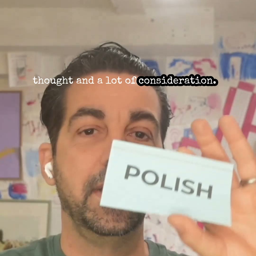 Scot Nery holding a card that says POLISH